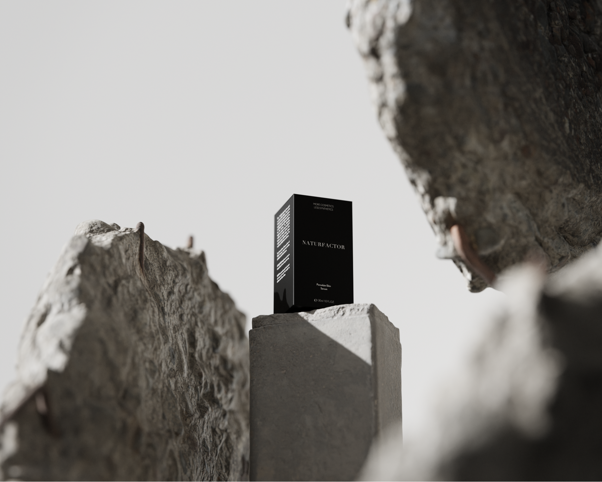 Porcelain Skin Serum Packaging on a grey rock